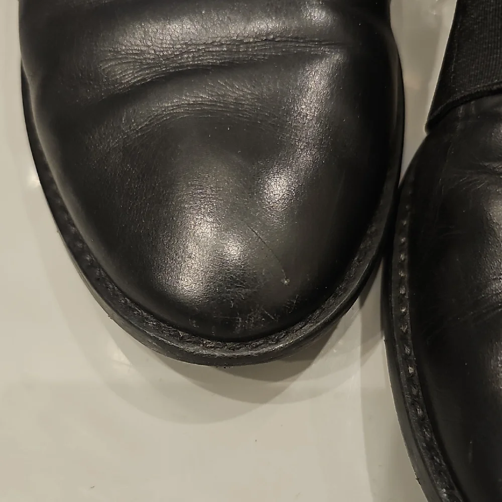 Stuart Weitzman Black Leather Slip-On Loafers